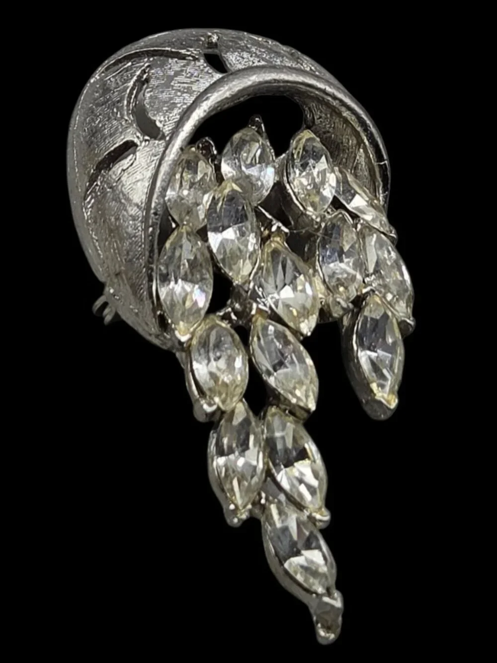None this brooch